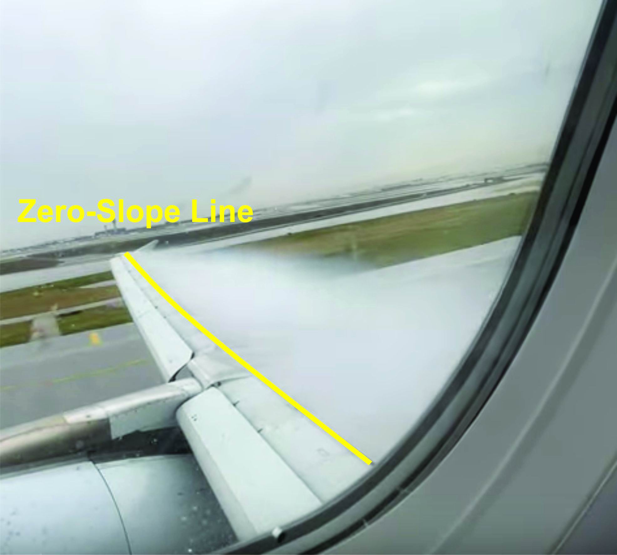 Boeing 757 wing at takeoff showing cloud formation